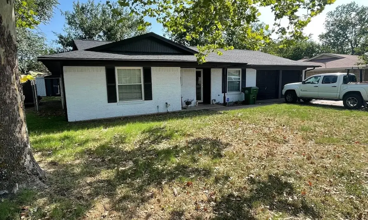 Professional roofing crew working on a residential roof in Delavan